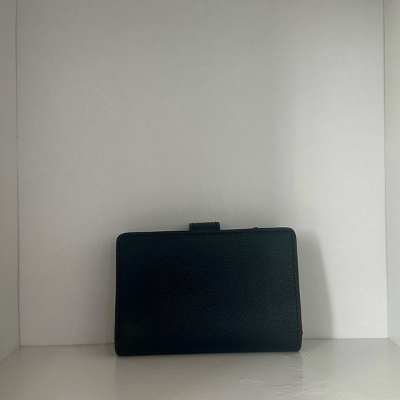 This coach wallet has been used before, but it is in decent shape. - Picture 3 of 6